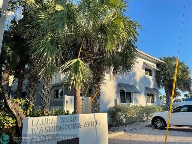 a view of a street with a building in the background