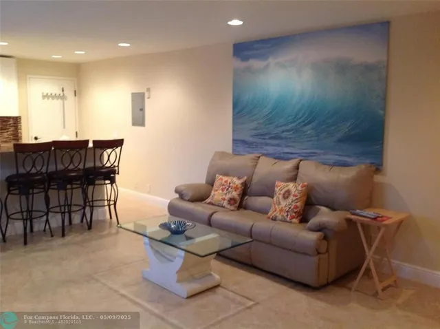 a living room with furniture a dining table and a piano