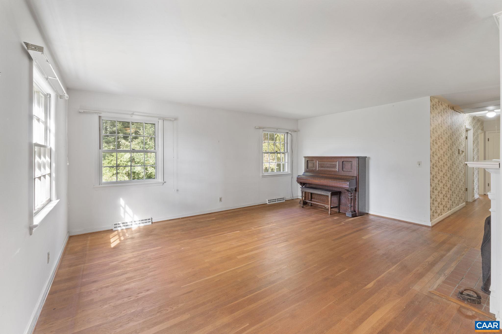 9281 Dick Woods Road Afton, VA 22920 - Photo 15 of 29 wooden floor in an empty room with a window