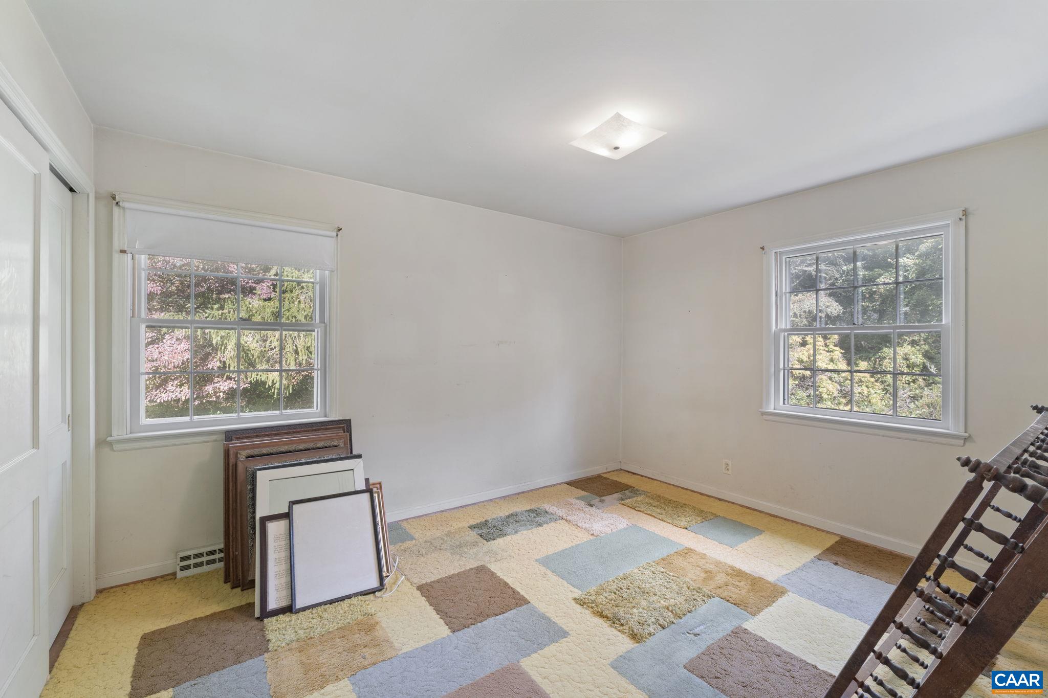 9281 Dick Woods Road Afton, VA 22920 - Photo 20 of 29 a bedroom with a bed and a window