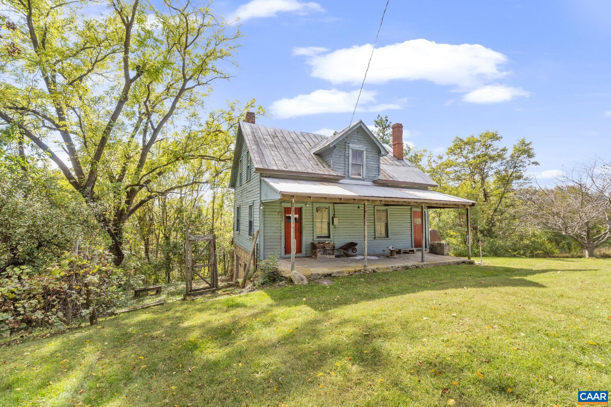 9281 Dick Woods Road Afton, VA 22920 - Photo 22 of 29 a view of a house with a big yard and potted plants