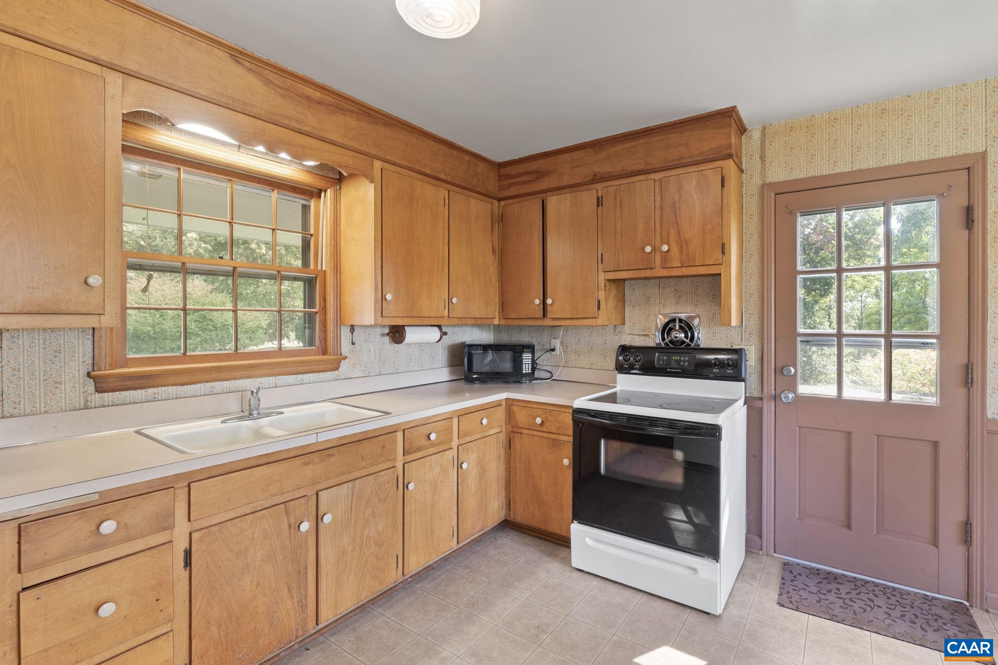 9281 Dick Woods Road Afton, VA 22920 - Photo 10 of 29 a kitchen with cabinets appliances and a sink