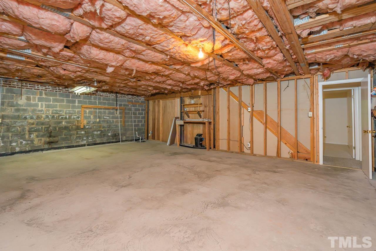 2913 Rue Sans Famille Raleigh, NC 27607 - Photo 23 of 25 a view of a room with wooden walls