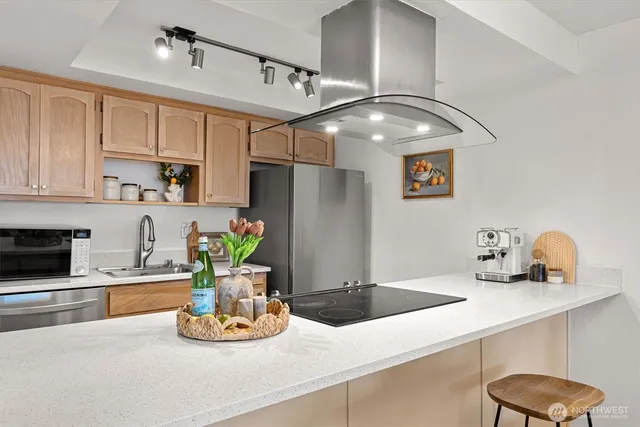a view of a dining room with furniture and chandelier