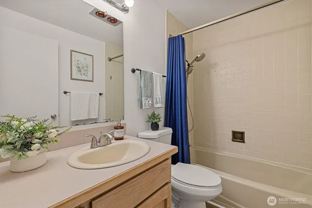 a bed room with a bed and a night stand