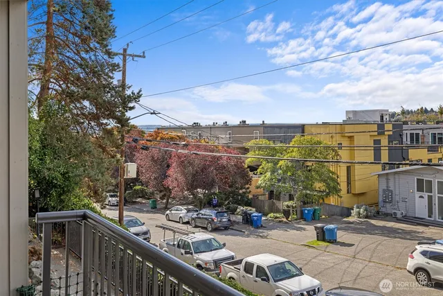 a view of a balcony with wooden floor