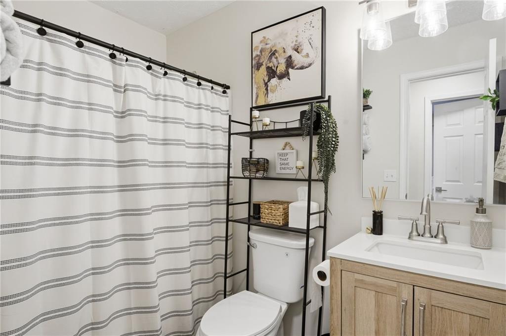 404 Brooks Street Dallas, GA 30157 - Photo 26 of 38 a bathroom with a sink toilet and shower