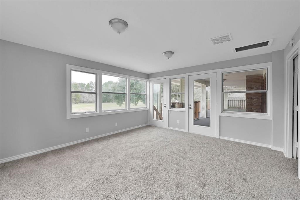 549 Brandon Road Conroe, TX 77302 - Photo 12 of 19 Sunroom leading to outdoor balcony offering great views