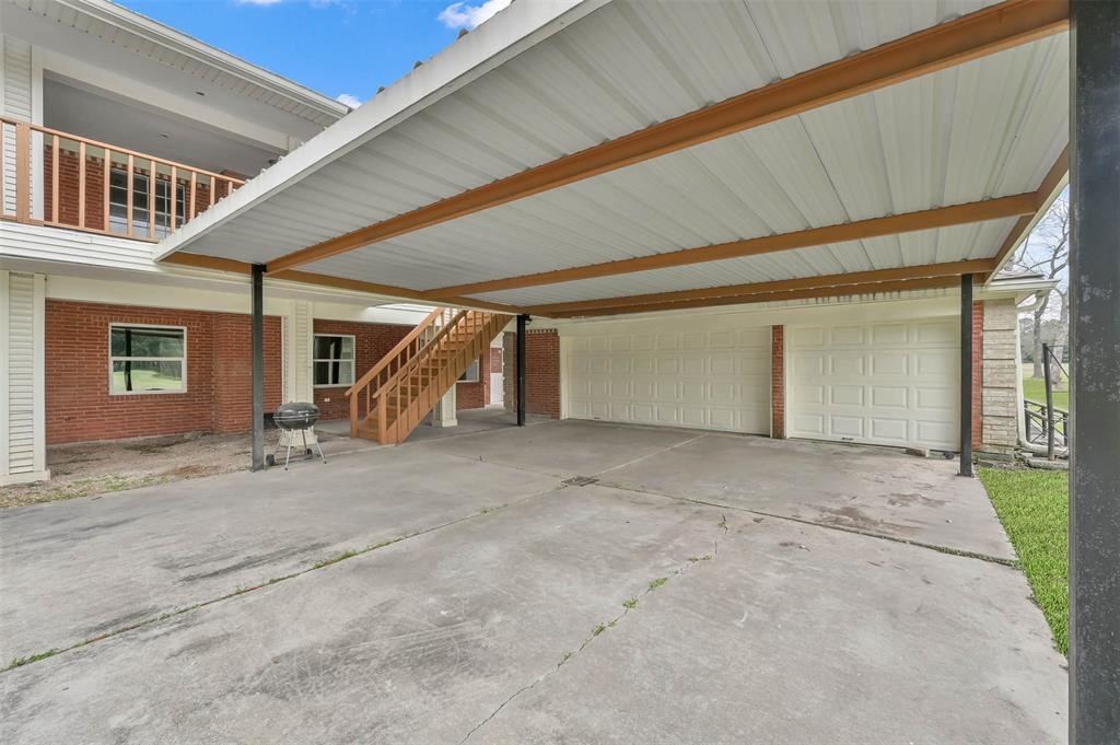 549 Brandon Road Conroe, TX 77302 - Photo 16 of 19 Large driveway with garage and carport