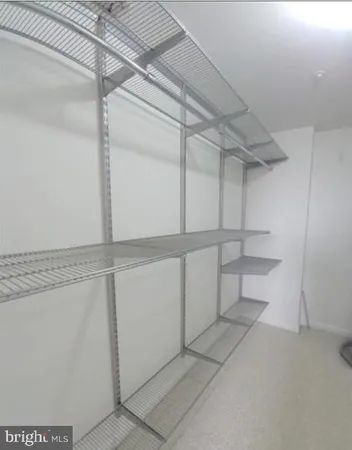 a view of an empty walk in closet