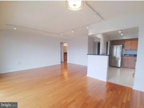 a view of a kitchen with a sink and an oven