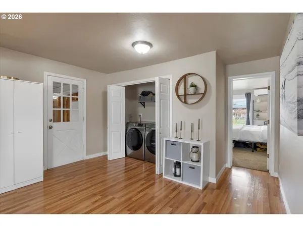a view of a livingroom with furniture wooden floor and window