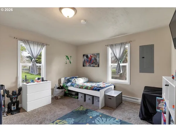 a living room with furniture and windows