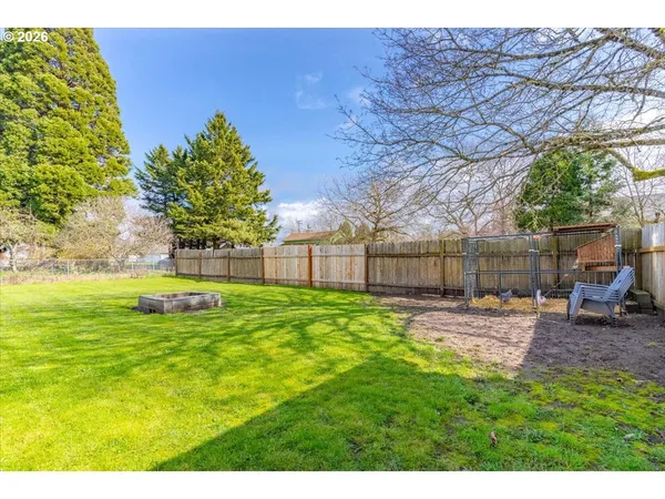 a view of a backyard with swimming pool