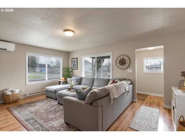a living room with furniture and a window
