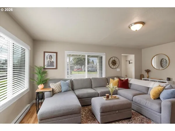 a living room with furniture and a large window