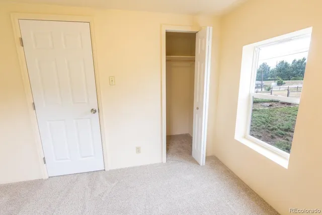 an empty room with windows