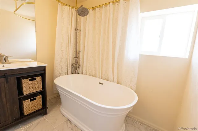 a bathroom with a sink and a bathtub
