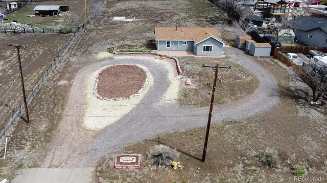 an aerial view of a house with a lake view