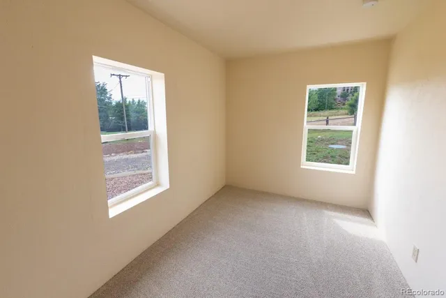 an empty room with windows