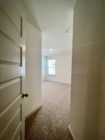 a view of hallway with window