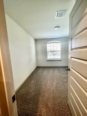 a view of a room that has a window in it