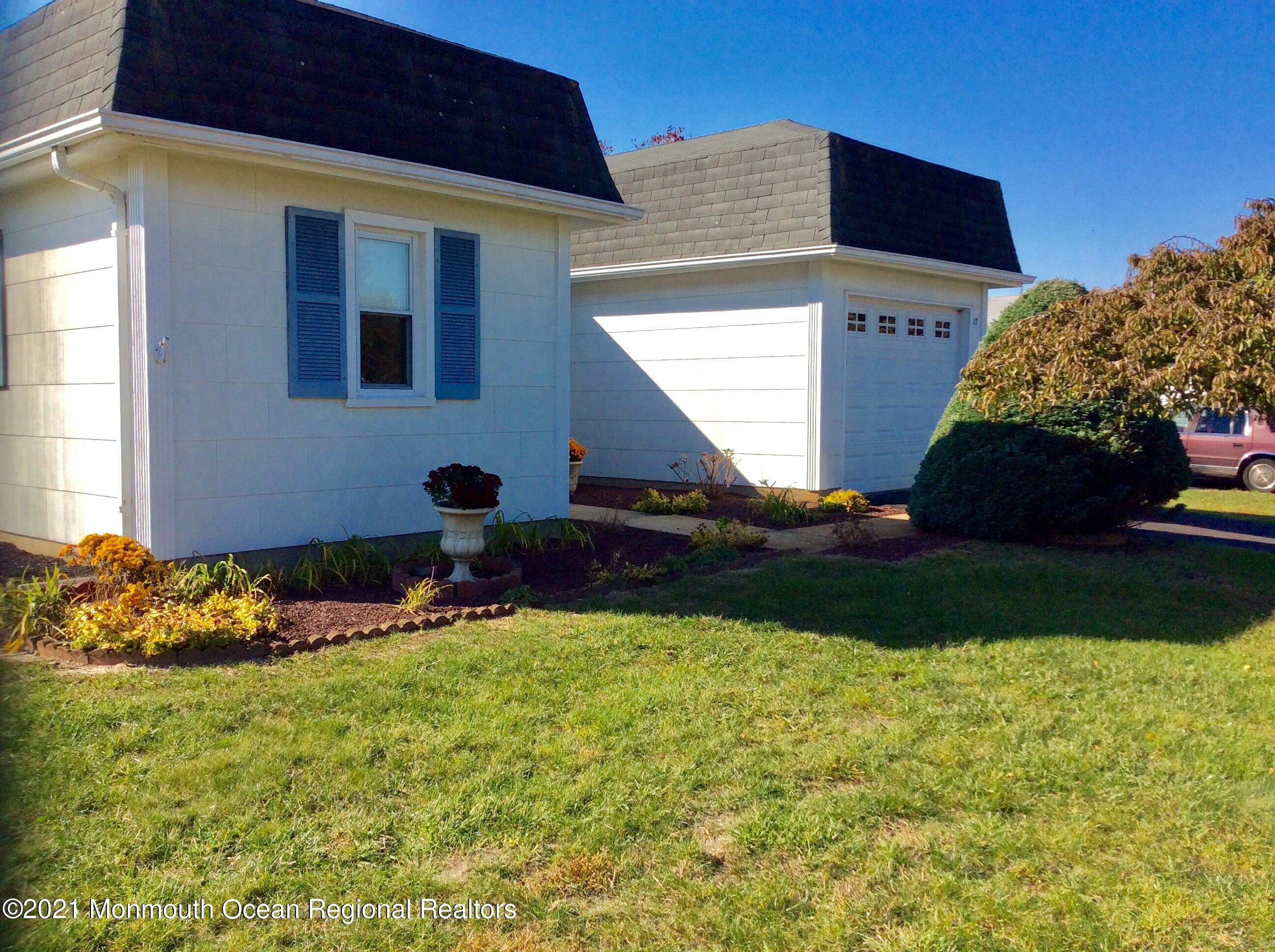 17 Phillips Road Brick, NJ 08724 - Photo 2 of 27 a front view of a house with a yard