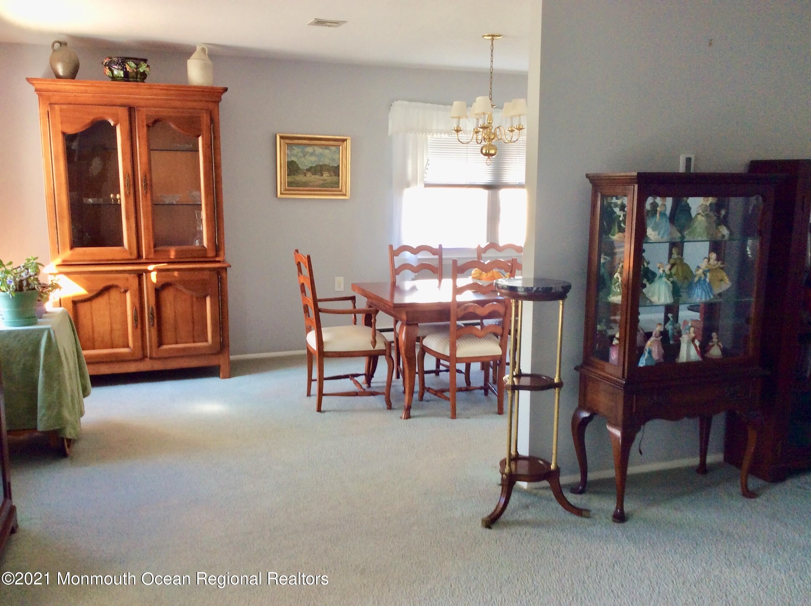 17 Phillips Road Brick, NJ 08724 - Photo 12 of 27 a living room with furniture a window and a flat screen tv