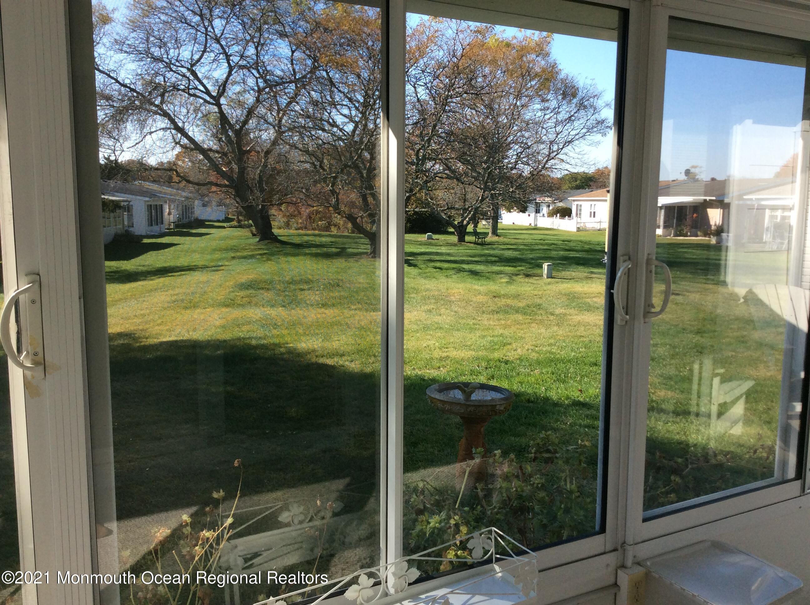 17 Phillips Road Brick, NJ 08724 - Photo 18 of 27 a view of a glass door and a yard