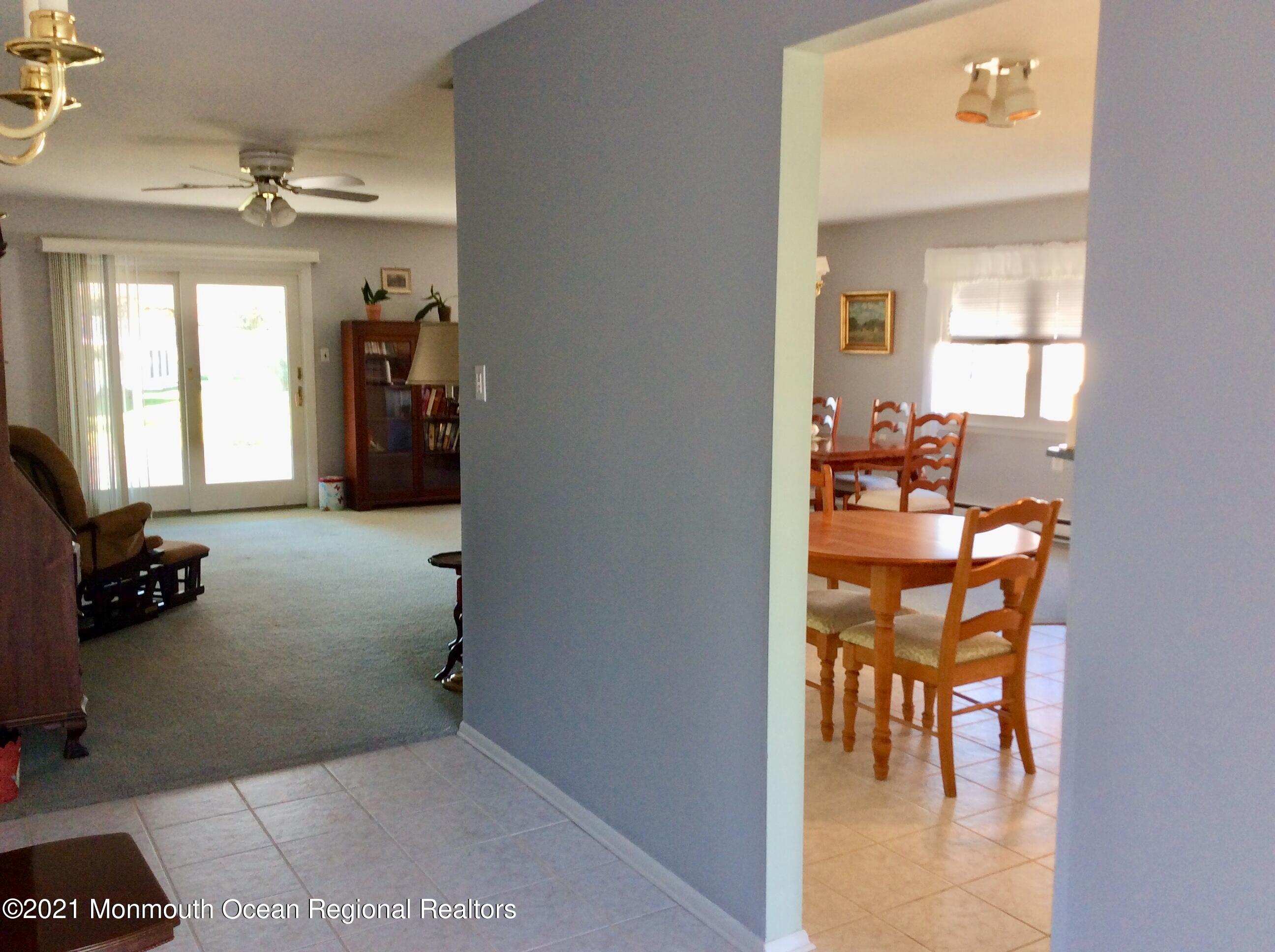 17 Phillips Road Brick, NJ 08724 - Photo 4 of 27 a room with furniture and a chandelier