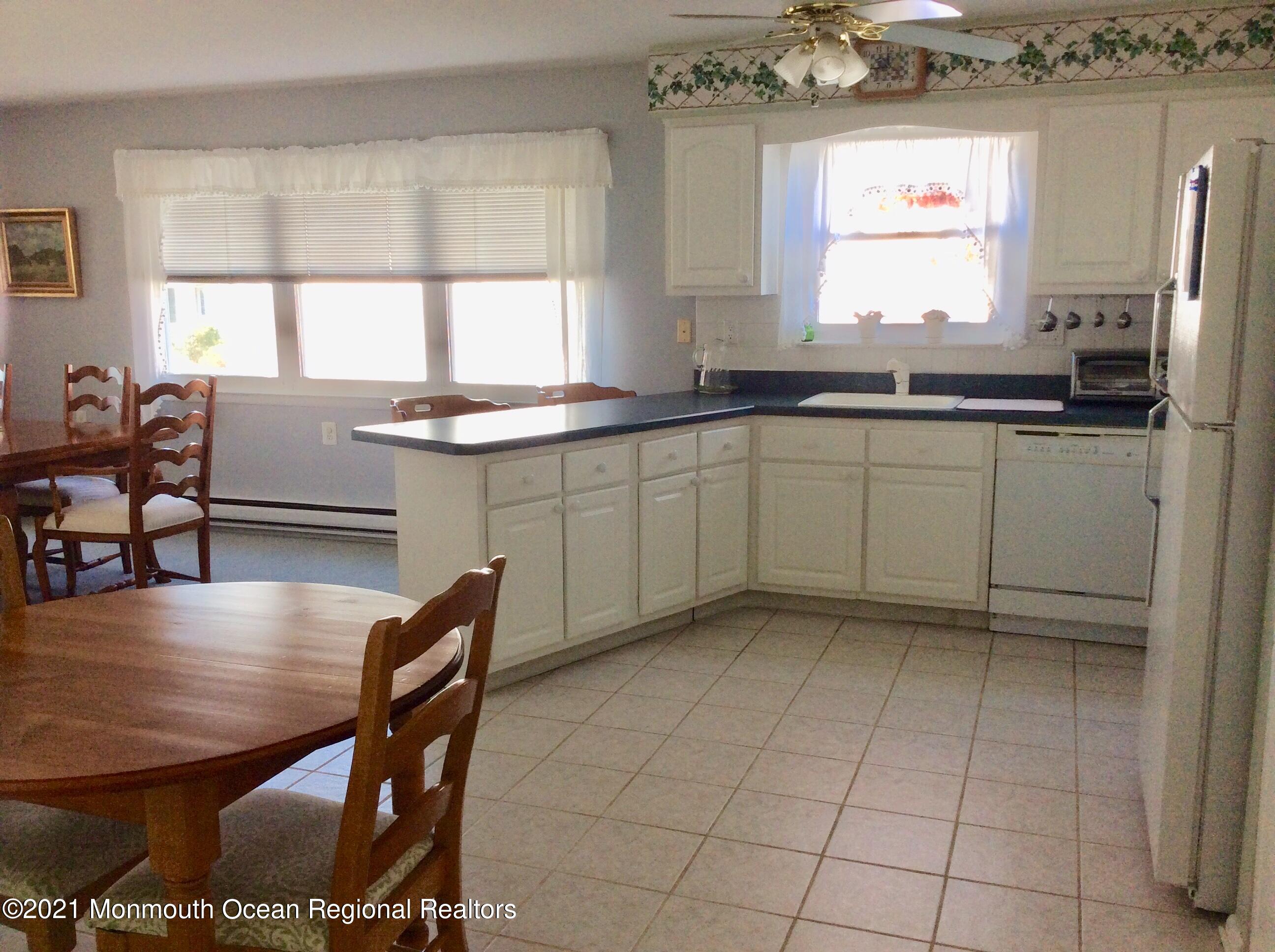 17 Phillips Road Brick, NJ 08724 - Photo 5 of 27 a kitchen with stainless steel appliances granite countertop a sink counter space and a window