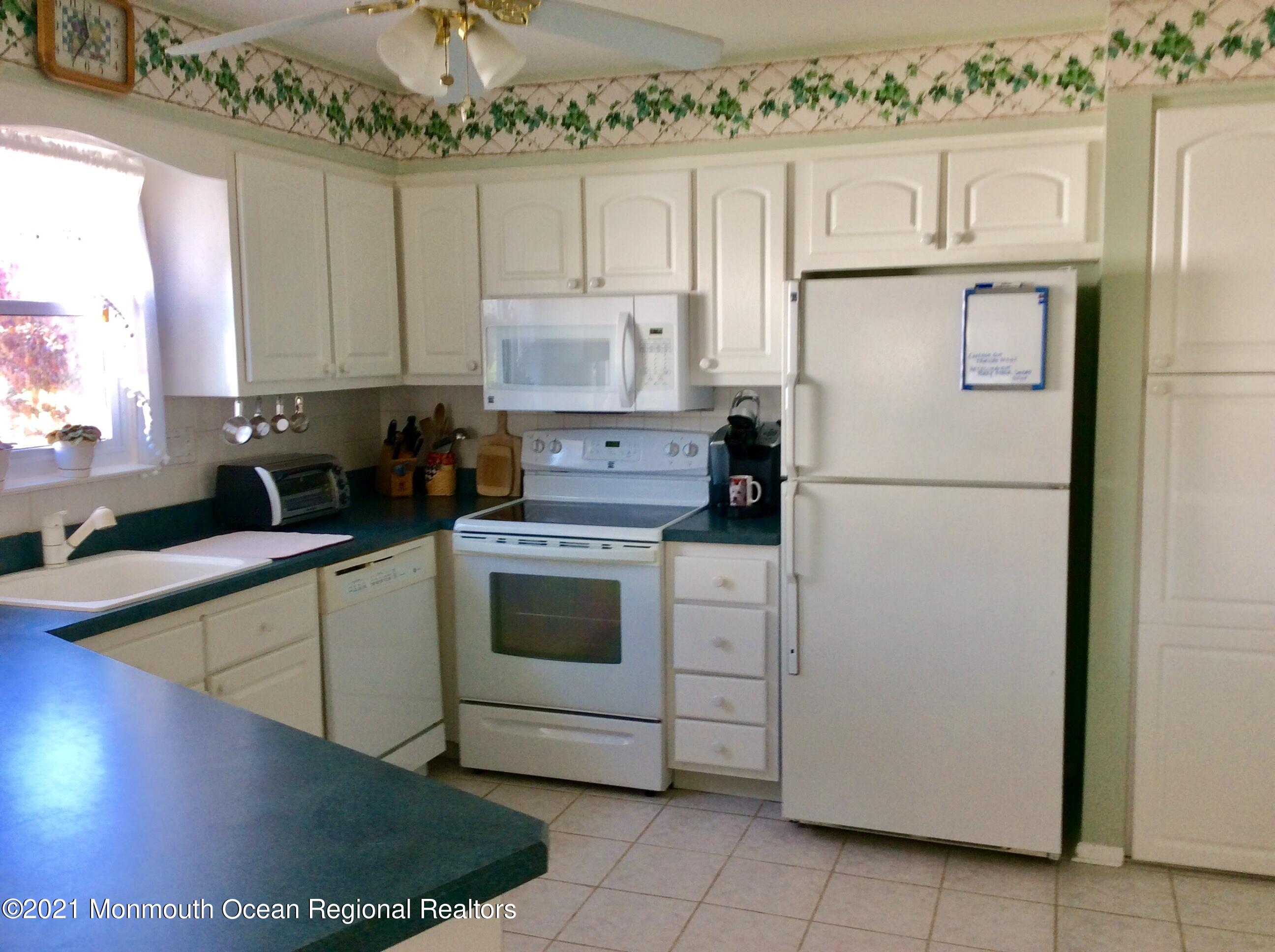 17 Phillips Road Brick, NJ 08724 - Photo 6 of 27 a kitchen with cabinets appliances and a sink