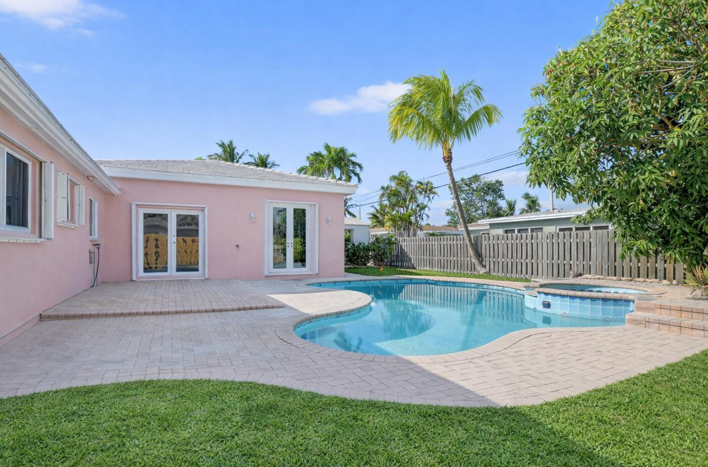 467 Northeast 31st Street Boca Raton, FL 33431 - Photo 2 of 18 a view of a house with a swimming pool