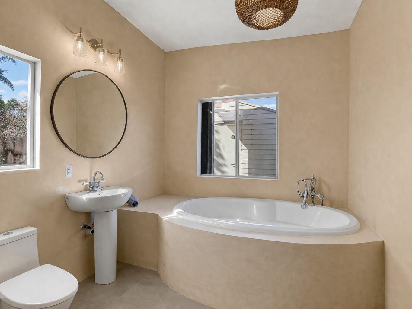 467 Northeast 31st Street Boca Raton, FL 33431 - Photo 5 of 18 a bathroom with a sink a toilet and a mirror