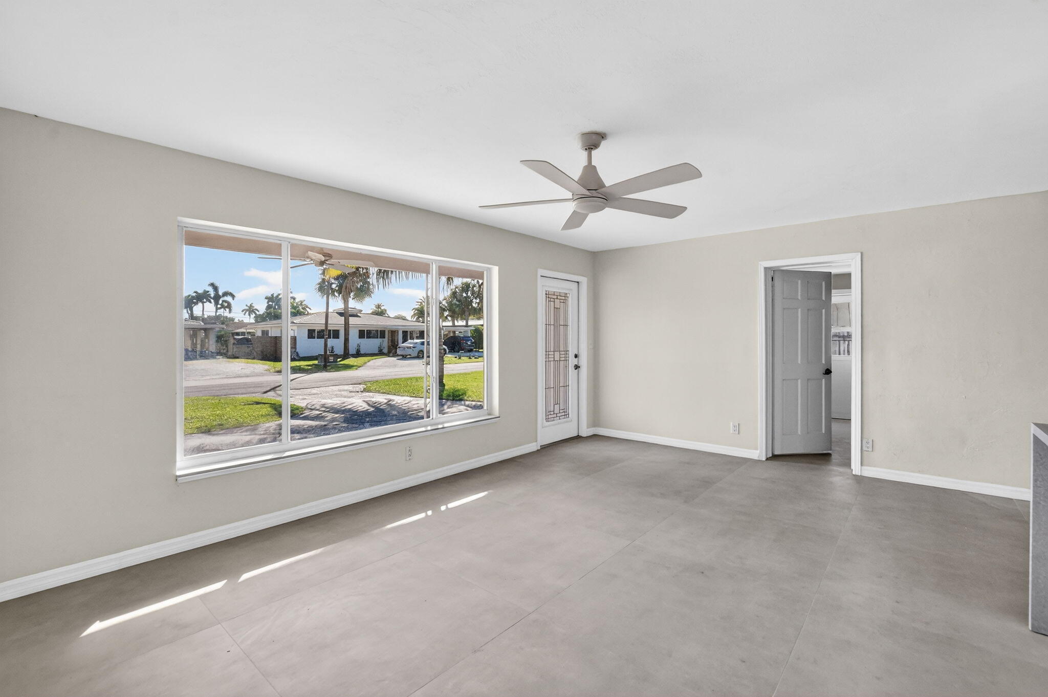 467 Northeast 31st Street Boca Raton, FL 33431 - Photo 10 of 18 an empty room with windows and outdoor view