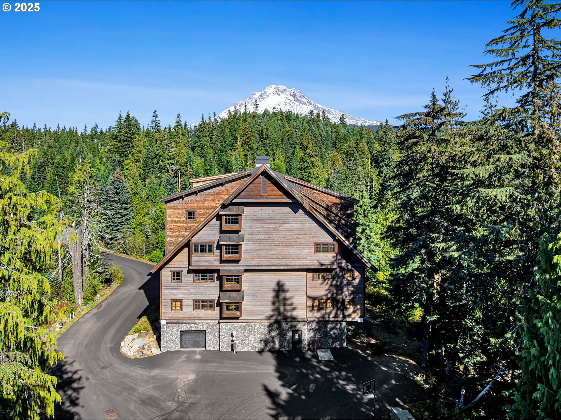 31254 East Collins Lake Road, Unit 22 Government Camp, OR 97028 - Photo 1 of 44 a view of a house with a yard