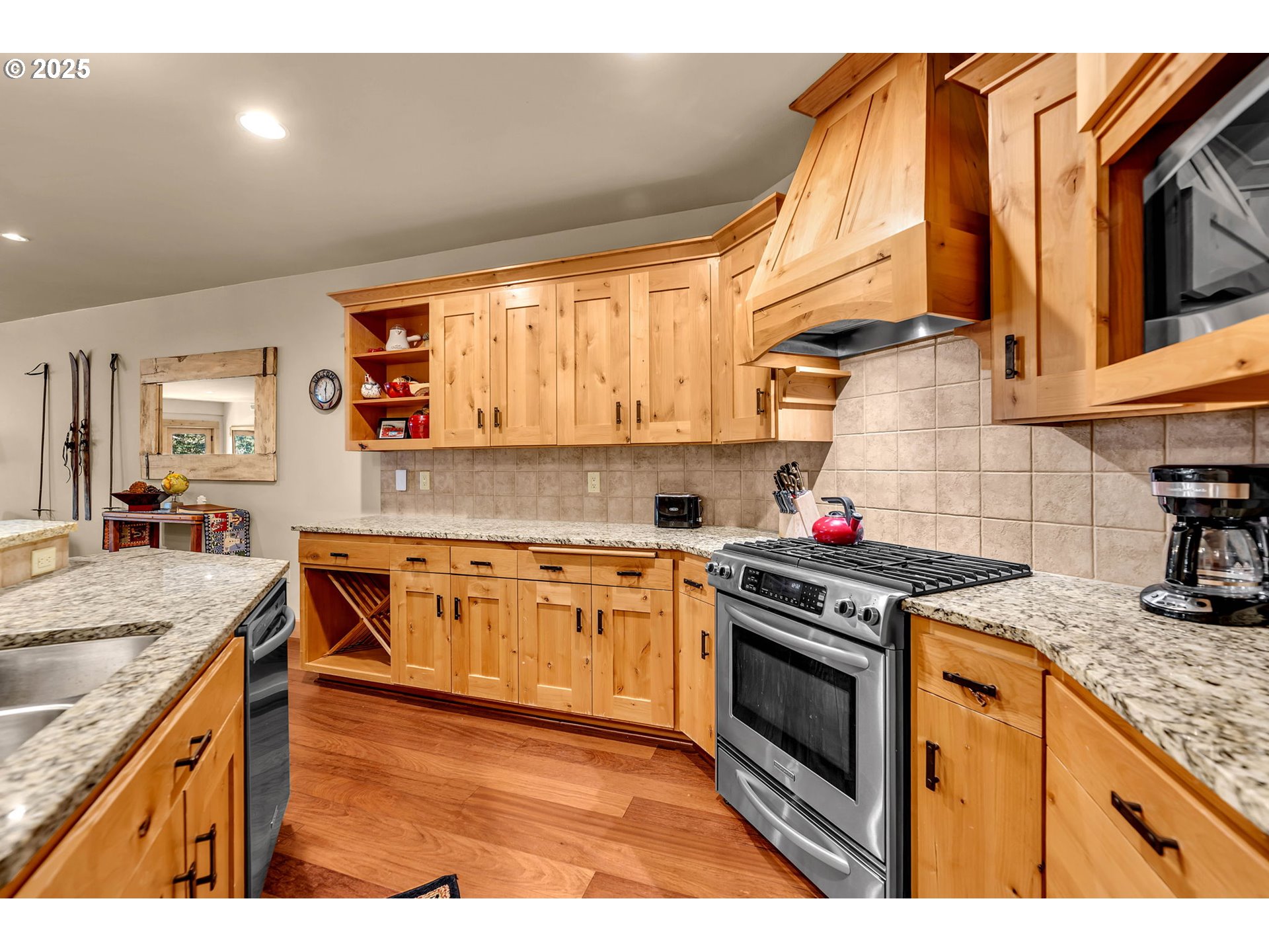31254 East Collins Lake Road, Unit 22 Government Camp, OR 97028 - Photo 13 of 44 a kitchen with stainless steel appliances granite countertop a stove a sink and a microwave