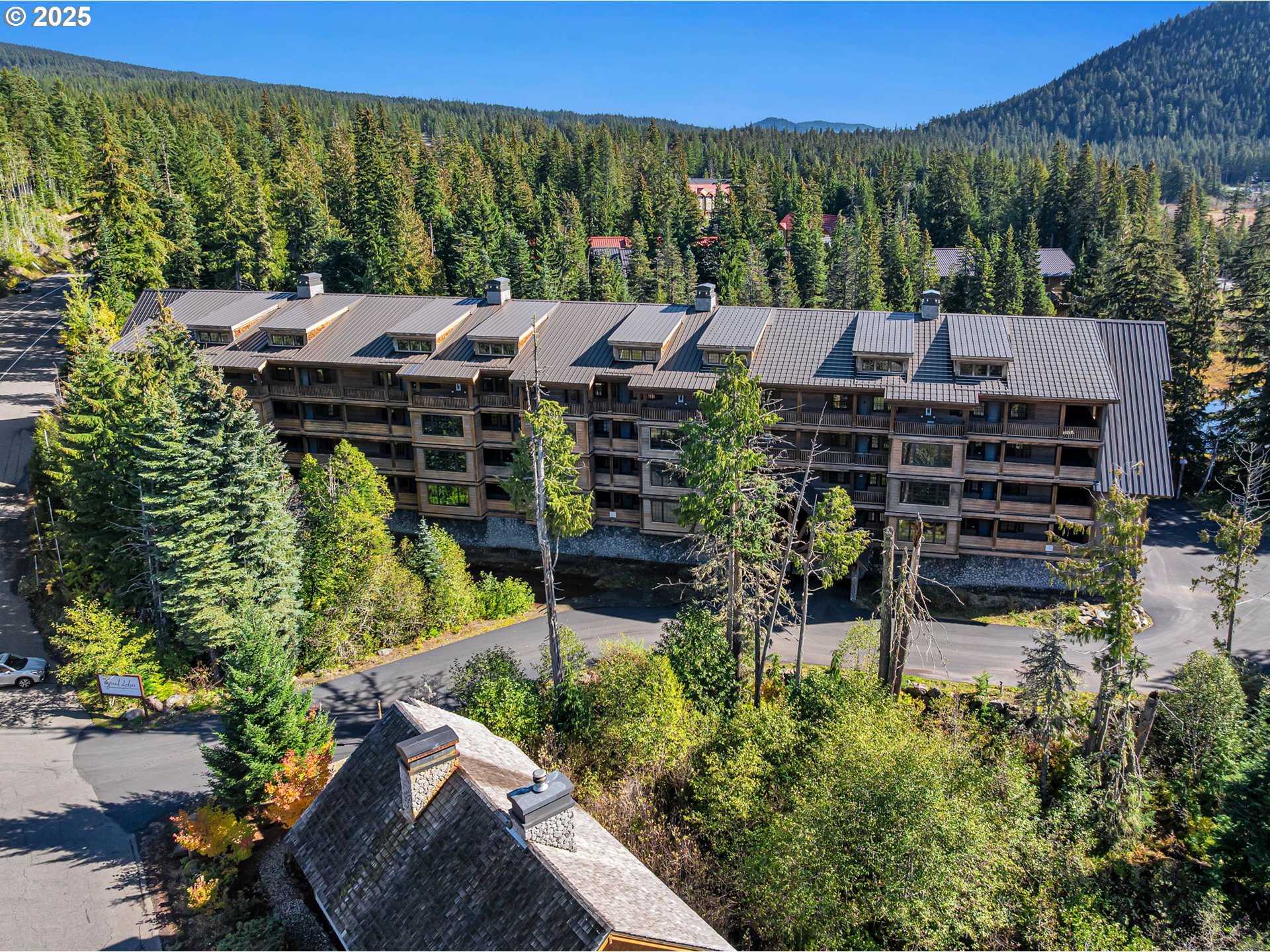 31254 East Collins Lake Road, Unit 22 Government Camp, OR 97028 - Photo 2 of 44 an aerial view of a house with a garden