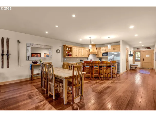 a view of a dining area with furniture and wooden floor