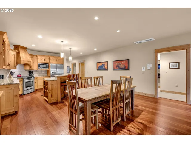 a view of a dining area with furniture and wooden floor