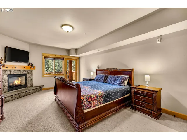 a bed room with a bed and a television