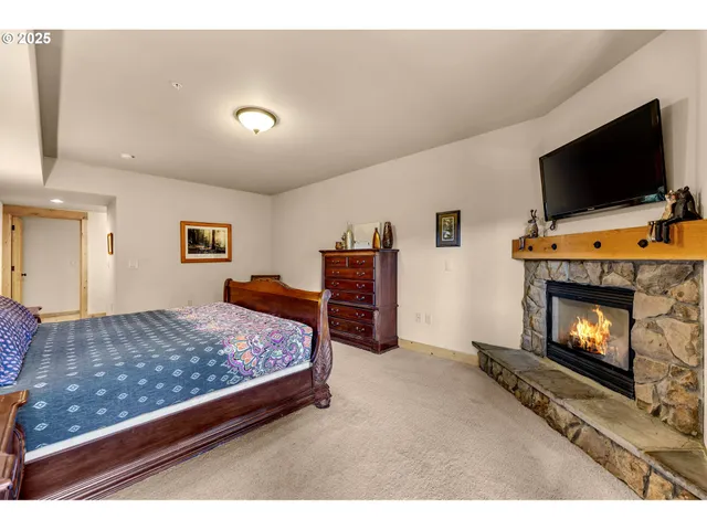 a living room with furniture flat screen tv and a fireplace