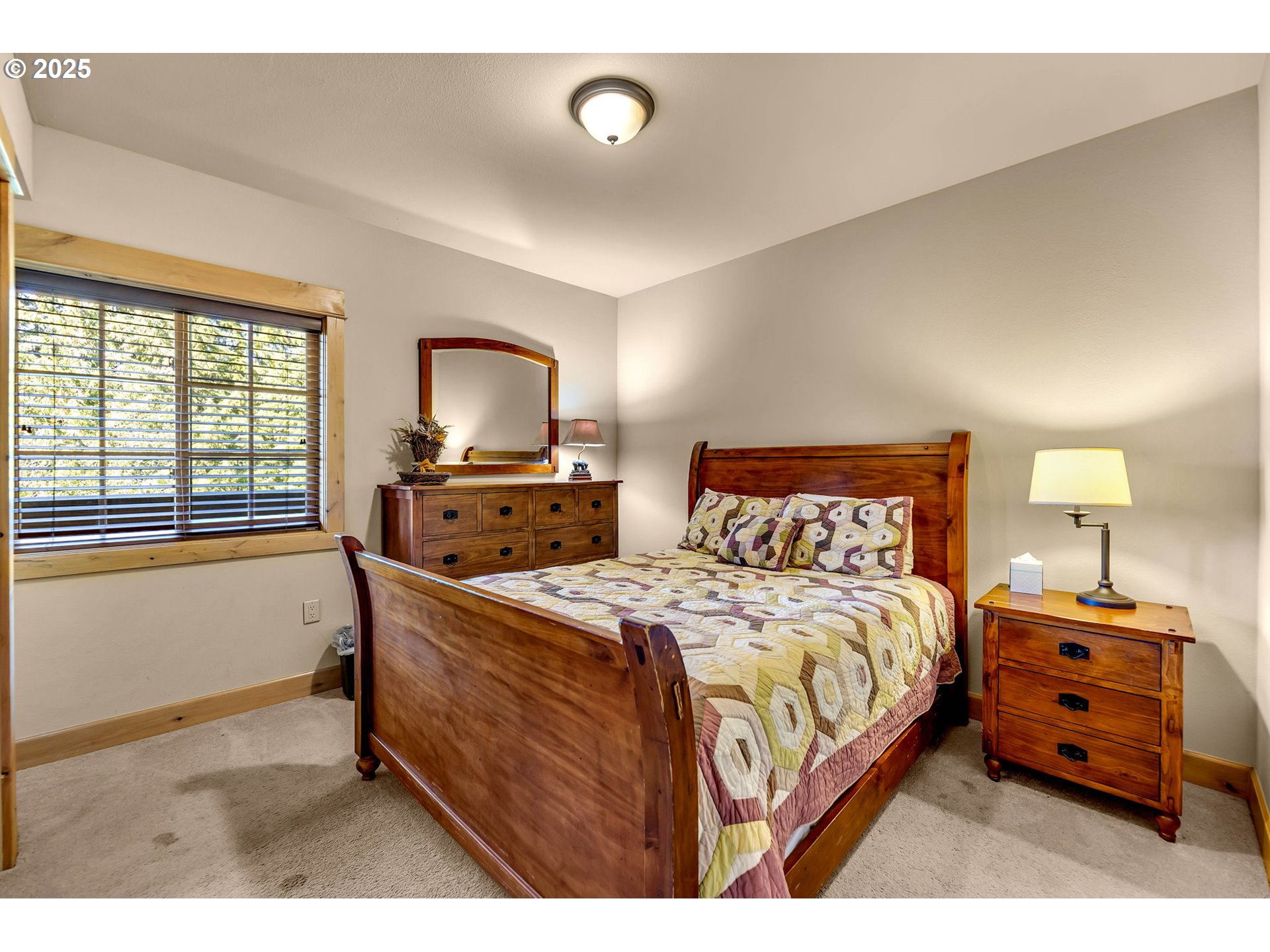 31254 East Collins Lake Road, Unit 22 Government Camp, OR 97028 - Photo 28 of 44 a bedroom with a bed and a window