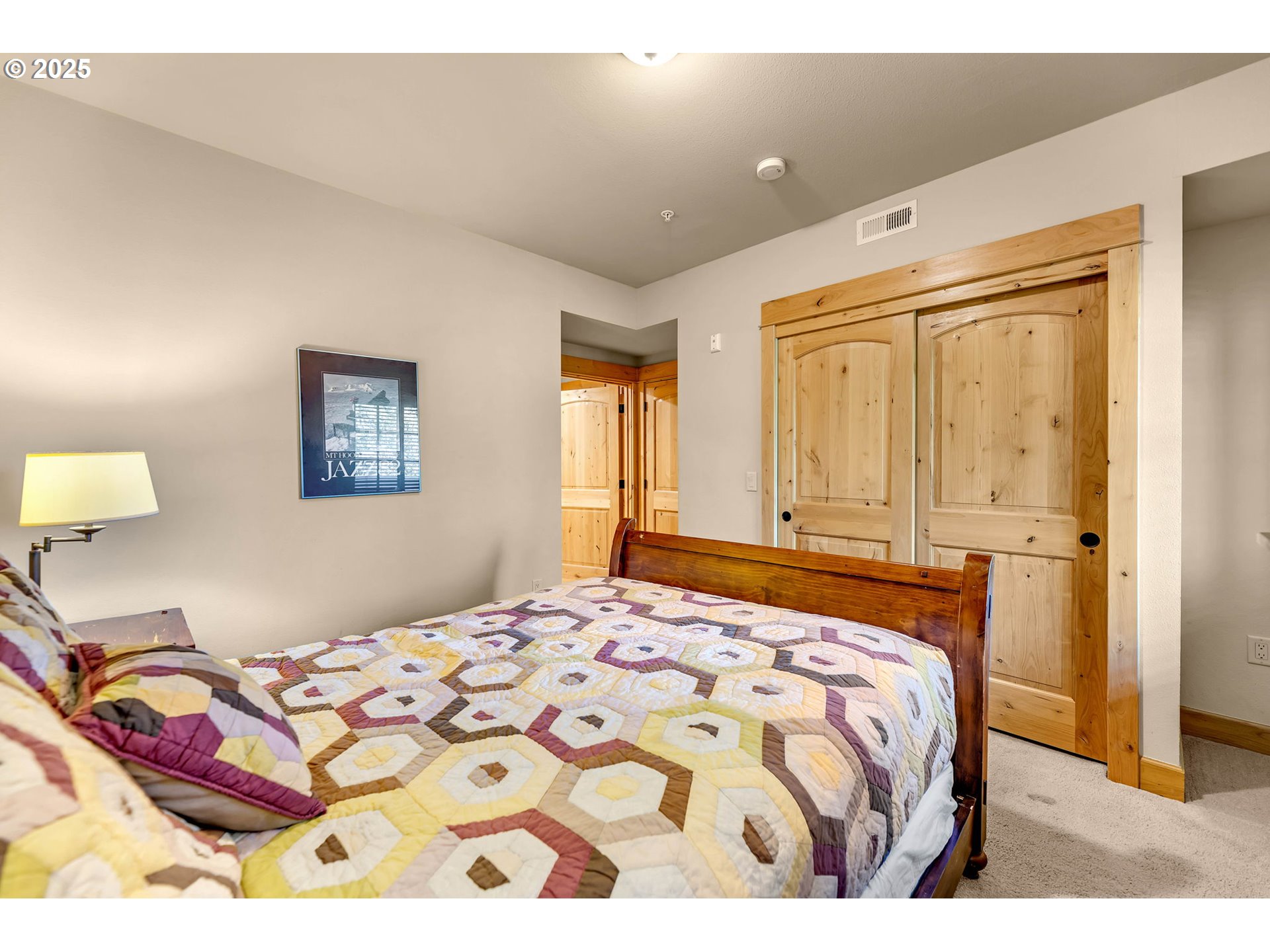 31254 East Collins Lake Road, Unit 22 Government Camp, OR 97028 - Photo 29 of 44 a bedroom with a bed and a window
