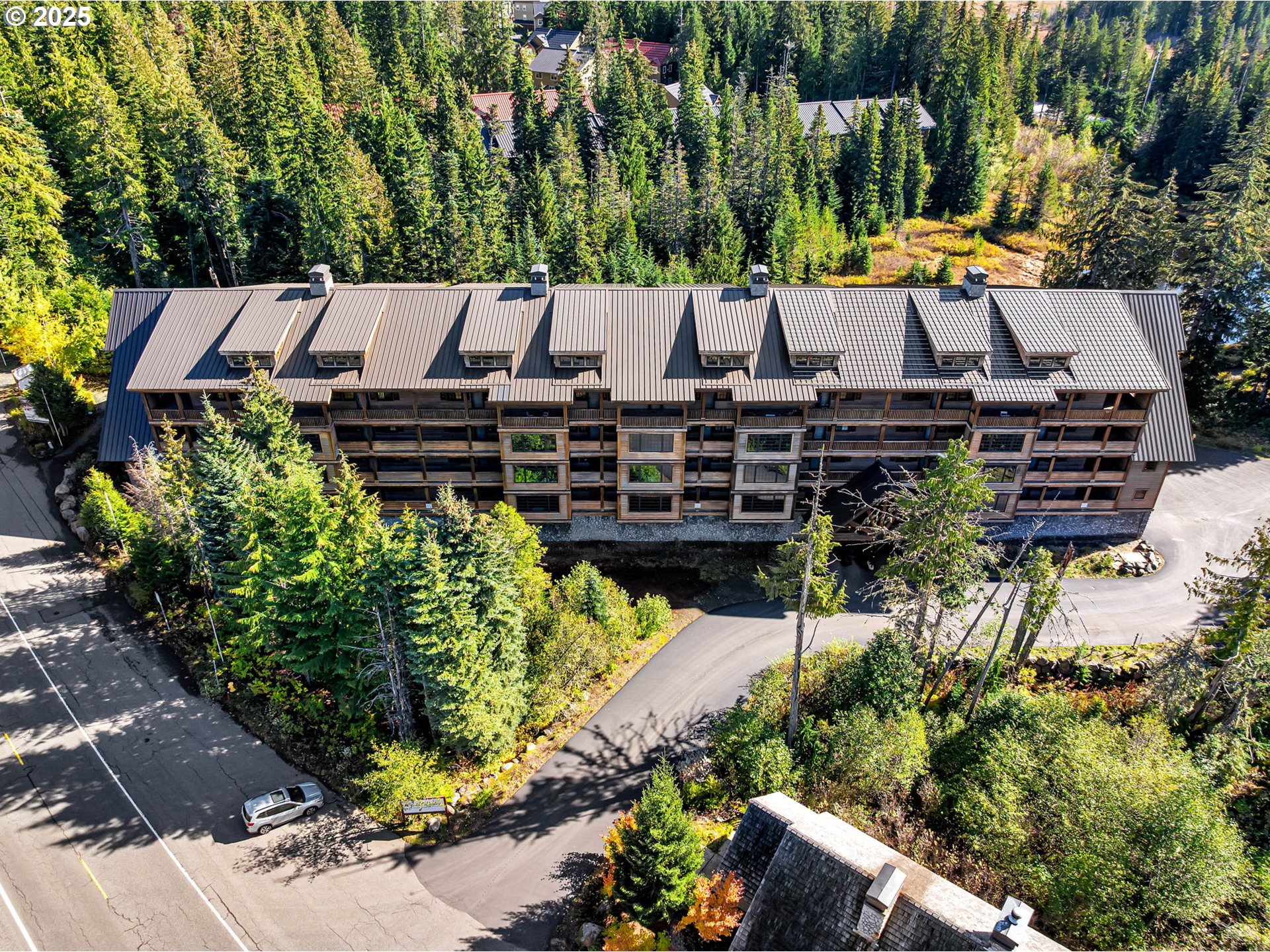 31254 East Collins Lake Road, Unit 22 Government Camp, OR 97028 - Photo 4 of 44 an aerial view of a house with a garden