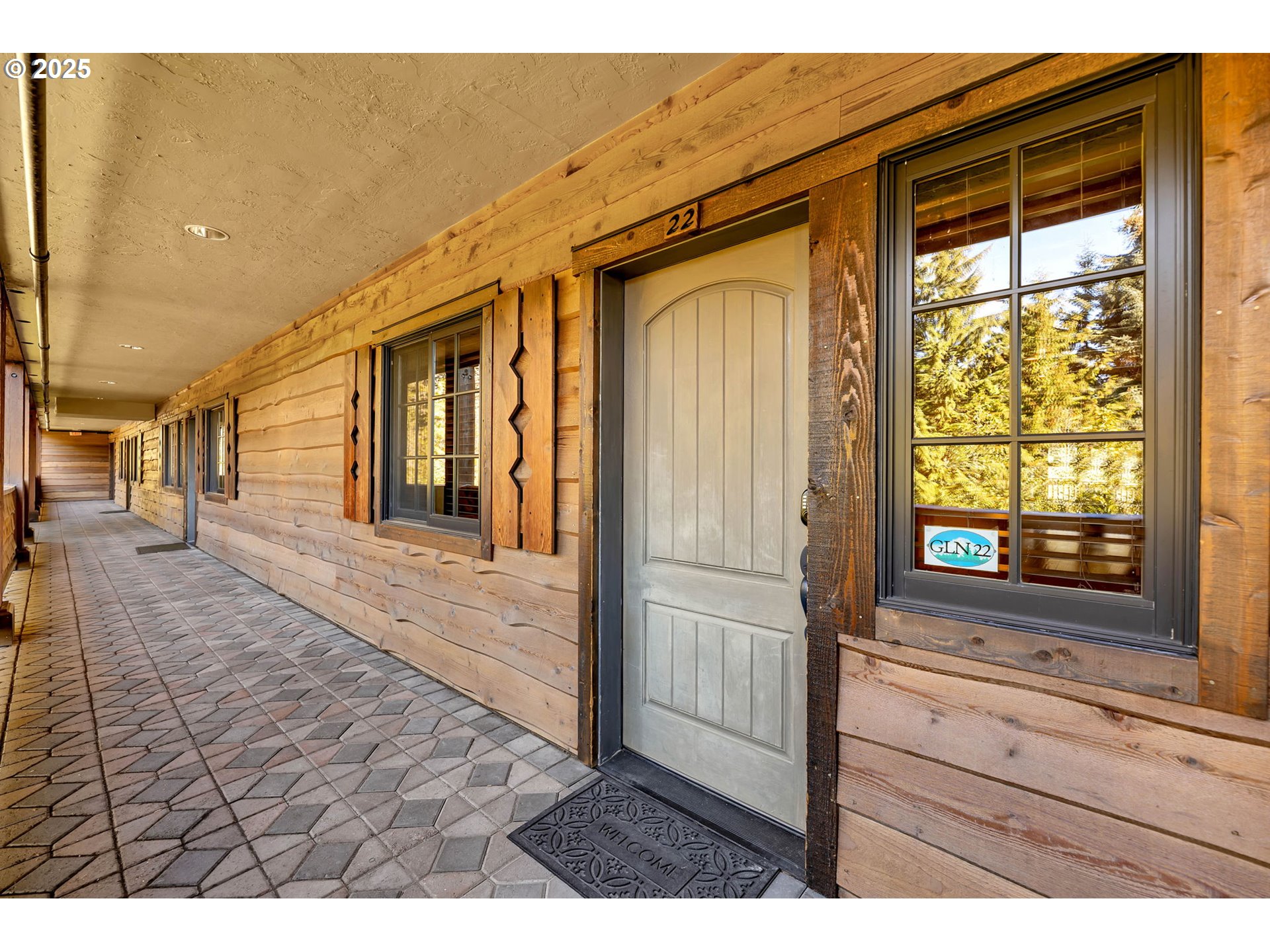 31254 East Collins Lake Road, Unit 22 Government Camp, OR 97028 - Photo 5 of 44 a view of hallway with wooden floor and windows