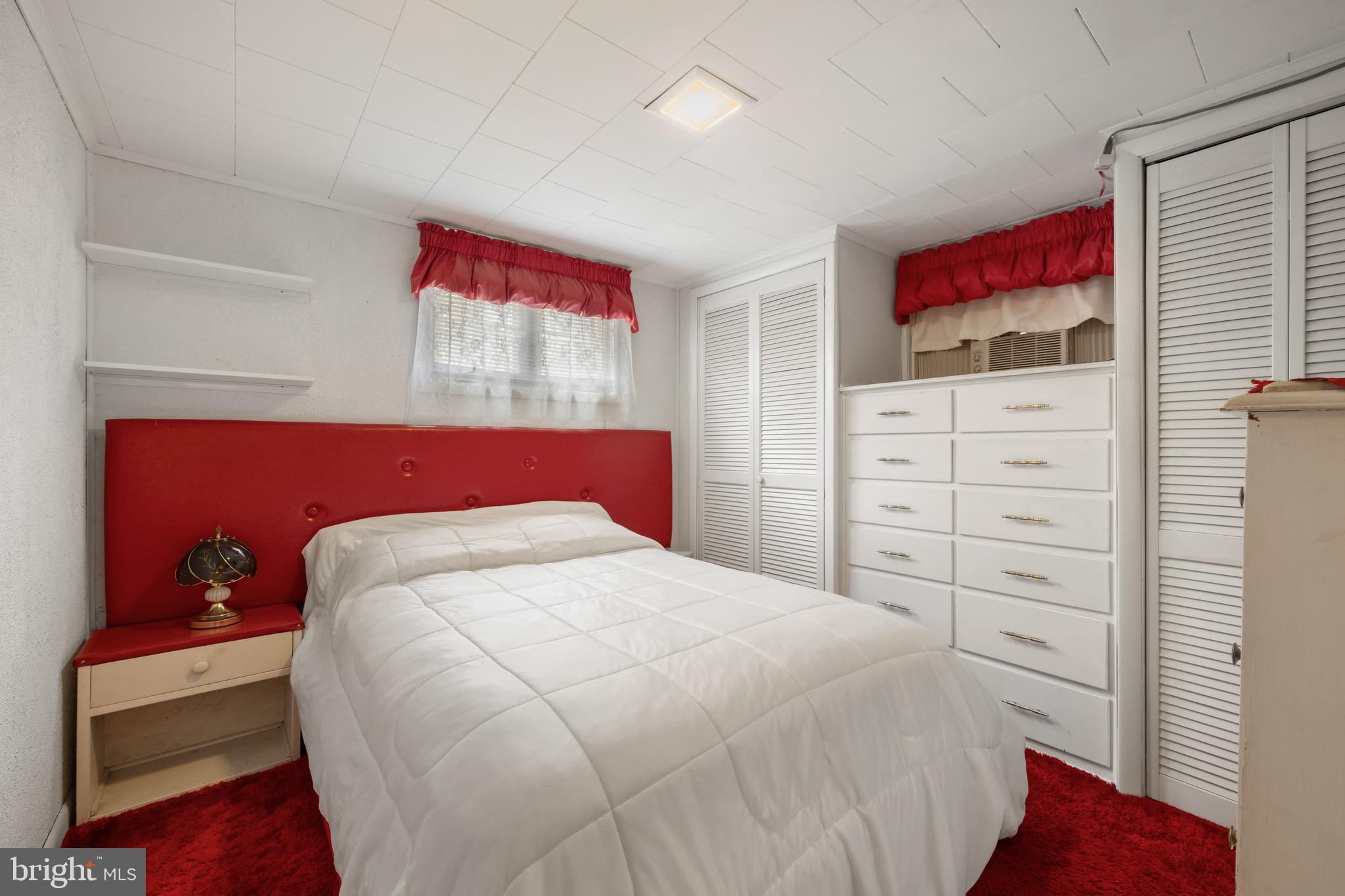 302 Tyler Avenue Carneys Point, NJ 08069 - Photo 16 of 27 a bedroom with a bed and a dresser