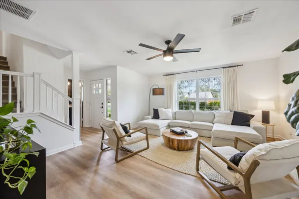 a living room with furniture and a large window