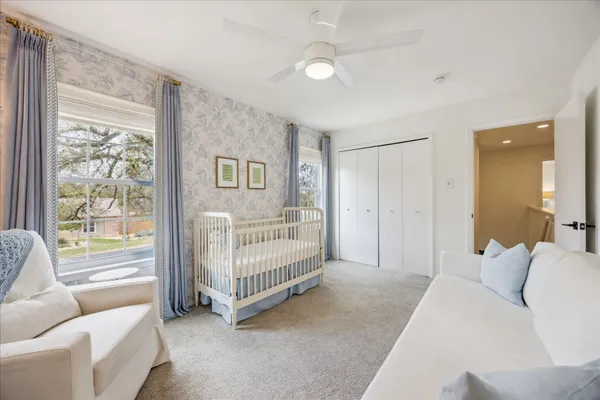 a bedroom with a bed and a desk