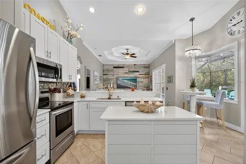 a kitchen with a sink stove and refrigerator